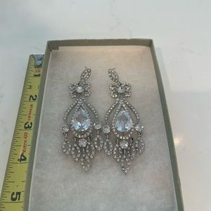 Large hanging earrings.